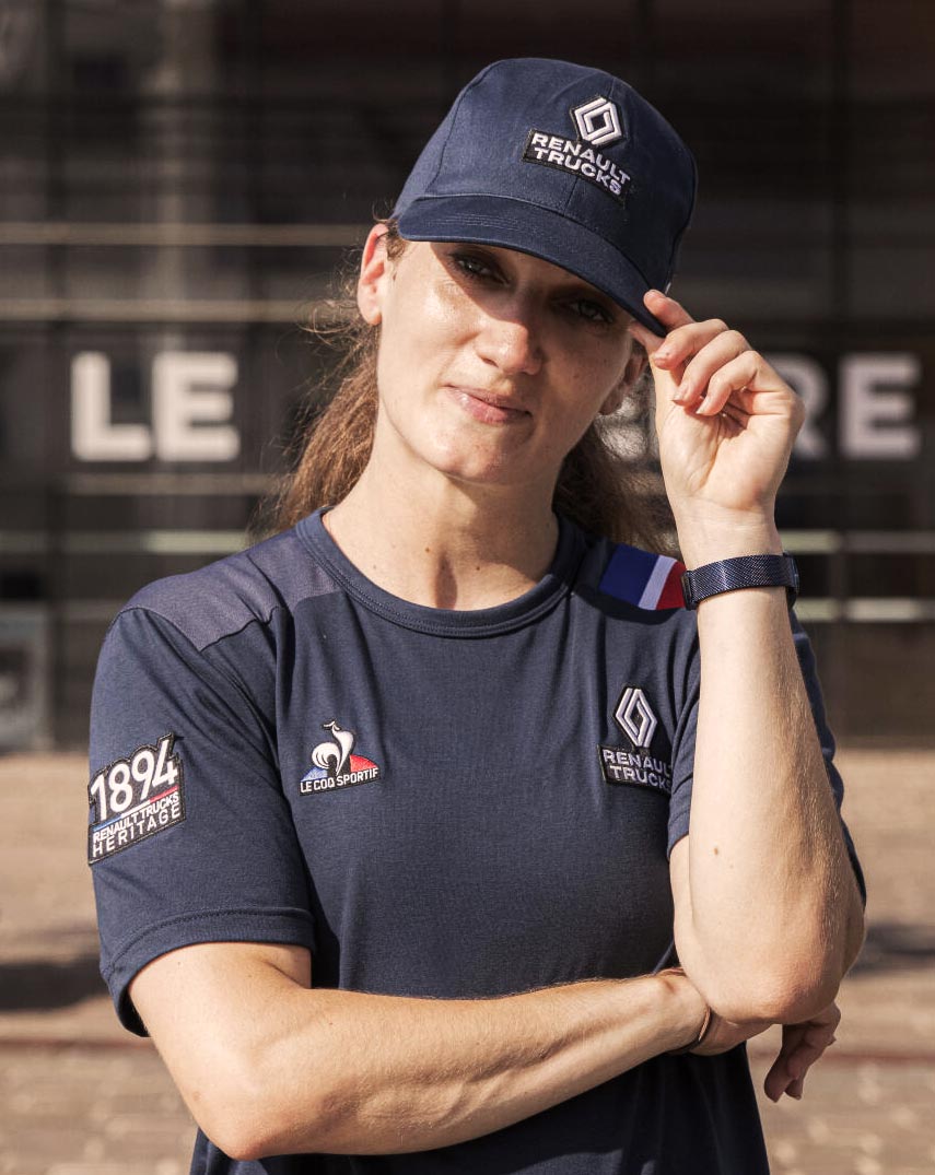 Woman wearing Le Coq Sportif cap in navy blue